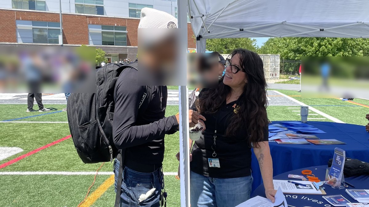 Sharon connecting with a young person at a community outreach event